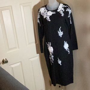 This is a Lily & Taylor Knit Dress made of unique and special yarn.